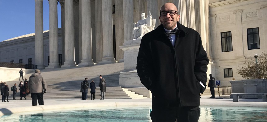 Tyson Timbs poses for a photo outside the U.S. Supreme Court on Nov. 28, 2018.