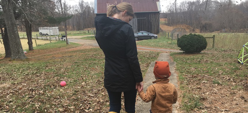 Jamie Tiralla, 36, walks with her 3-year-old son, Isaac, on the family’s farm in Prince Frederick, Maryland. Tiralla and her husband are young farmers managing a 115-acre farm that has been in his family for nearly a century. 