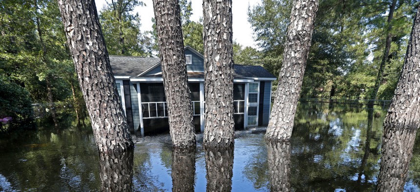 A house and pine trees are seen in South Carolina floodwaters in the aftermath of Hurricane Florence on Sept. 21, 2018. 