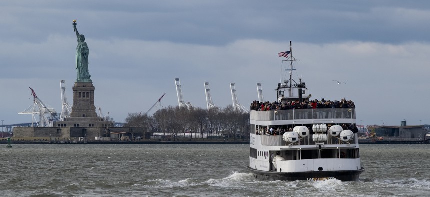 A ferry full of passengers steams towards the Statue of Liberty on Dec. 22, 2018, in New York. The national landmark remained open despite a partial government shutdown after New York Governor Andrew Cuomo made funding available.