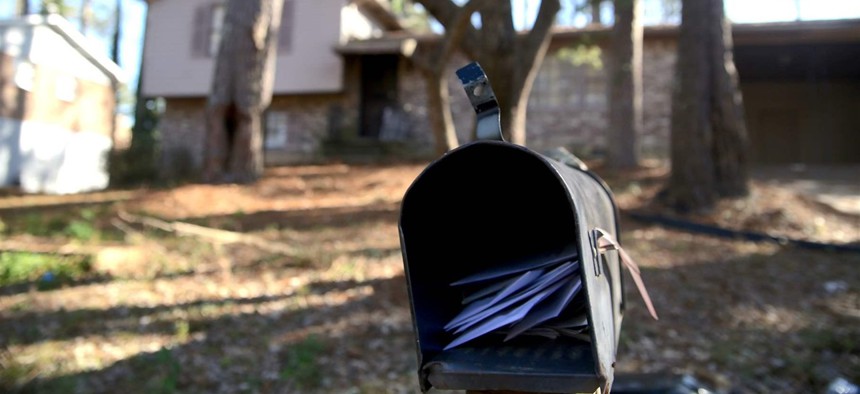 Letters pile up in the mailbox of the College Park, Georgia, split-level home from which the Hicks family was recently evicted. 