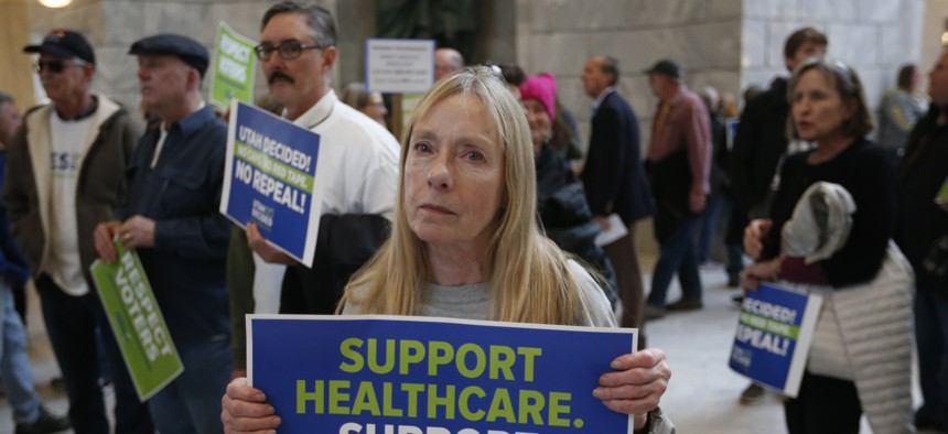 Supporters of a voter-approved measure to fully expand Medicaid gather others at a rally to ask lawmakers not to change the law during the first day of the Utah Legislature, at the Utah State Capitol, Monday, Jan. 28, 2019, in Salt Lake City.