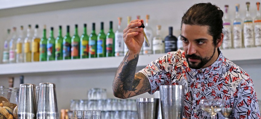 A bartender at the restaurant Gracias Madre in West Hollywood mixes a CBD cocktail.