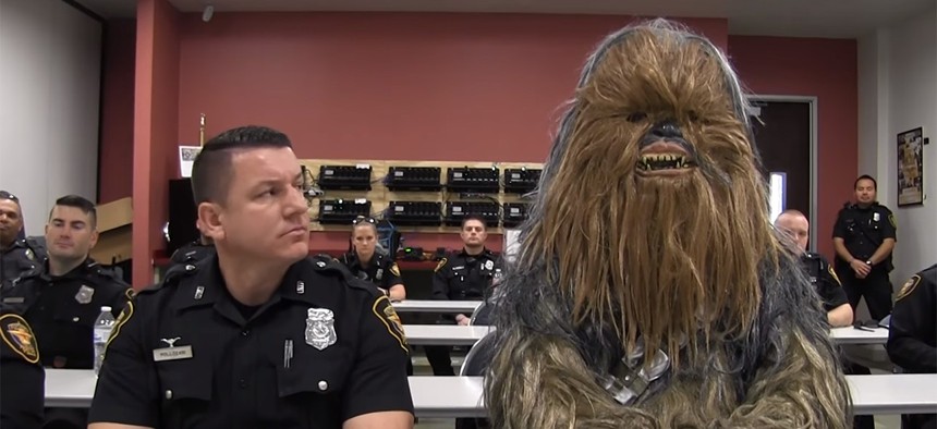 Fort Worth Police Officer Jimmy Pollozani gets ready to make the rounds with his rookie — make that Wookiee — partner of the day, Chewbacca (Sgt. Trey Gibbs), in a Star Wars-themed recruiting video that has drawn nearly 3 million views on social media.