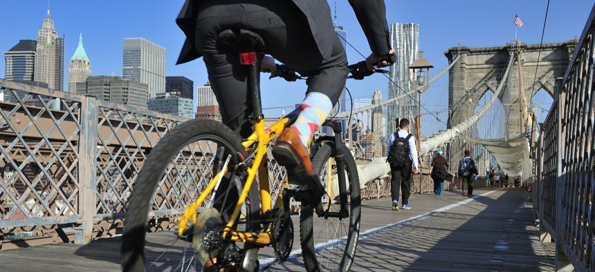Bike riders commuting to Manhattan over the Brooklyn Bridge.
