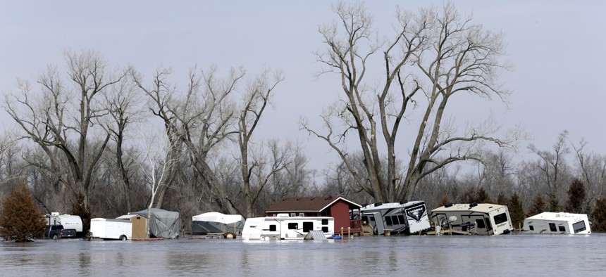 Flooded RV's, washed away by the flood waters of the Platte River, are seen in Merritt's RV Park in Plattsmouth, Neb., Sunday, March 17, 2019. 