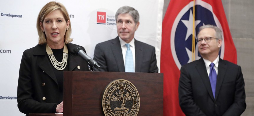 Holly Sullivan, left, of Amazon Public Policy, talks about a decision by Amazon to locate an operations hub in Nashville , Tenn. With Sullivan are Economic and Community Development Commissioner Bob Rolfe, center, and Nashville Mayor David Briley, right