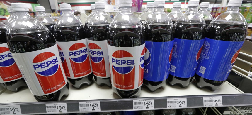 Pepsi products fill shelves in a convenience store in Kent, Wash. Voters in the state last year approved a measure to block local taxes on Soda.