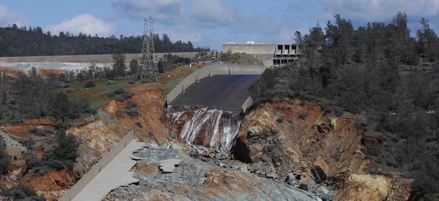 A small flow of water goes down Oroville Dam's crippled spillway on Feb. 28, 2017, in Oroville, California.
