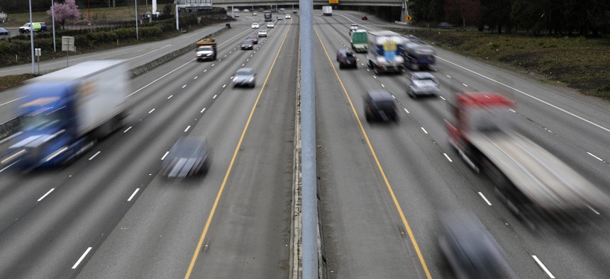 Cars and trucks travel on Interstate Highway 5 near Olympia, Wash., Monday, March 25, 2019. 