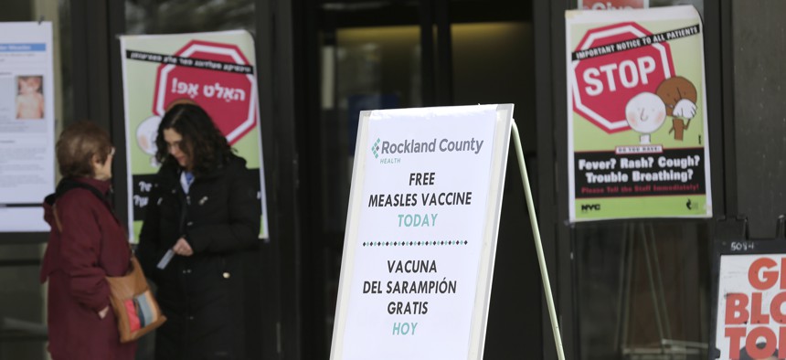 Signs about measles and the measles vaccine are displayed at the Rockland County Health Department in Pomona, N.Y. on March 27, 2019. County officials declared a state of emergency and banned unvaccinated children from inside public places. 