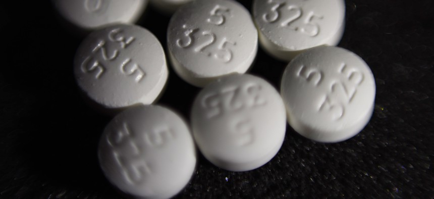 An arrangement of pills of the opioid oxycodone-acetaminophen.