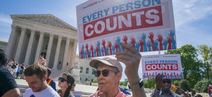 Immigration activists rally outside the Supreme Court as the justices hear arguments over the Trump administration's plan to ask about citizenship on the 2020 census, in Washington, Tuesday, April 23, 2019. 