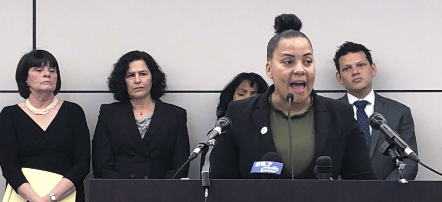 Suffolk District Attorney Rachael Rollins speaks during a news conference announcing a plan to file a federal lawsuit against U.S. Immigration and Customs Enforcement.