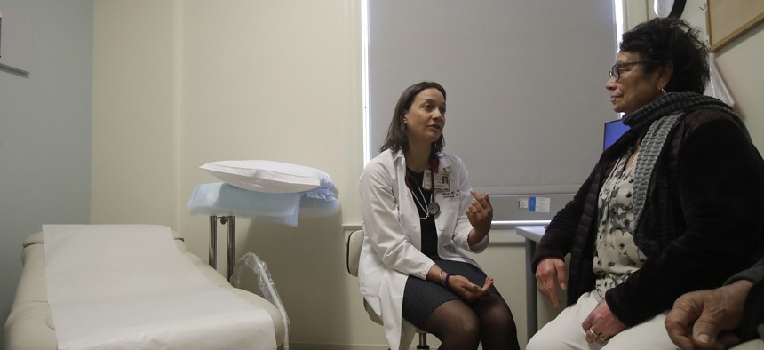 A doctor speaks with a patient in Stanford, CA.