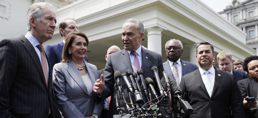 Speaker of the House Nancy Pelosi of Calif., Senate Minority Leader Sen. Chuck Schumer of N.Y. and other Democrats, talk to the media after meeting with President Donald Trump in the Cabinet Room of the White House, Tuesday, April 30, 2019, in Washington.