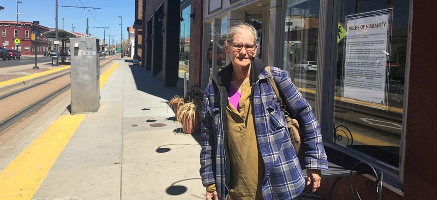 Debbie Hyatt stands outside the Impact Humanity store in downtown Denver. She sleeps in a shelter now but for a time slept on the sidewalk.