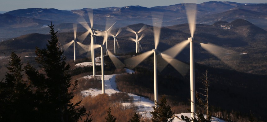 The blades of wind turbines catch the breeze at the Saddleback Ridge wind farm in Carthage, Maine. 