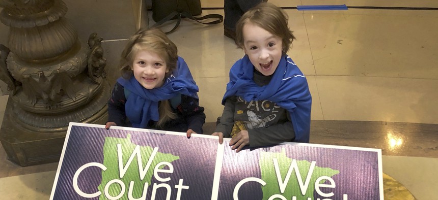 Noelle Fries, 6, left, and Galen Biel, 6, both of Minneapolis, attend a rally at the Minnesota Capitol on April 1, 2019, to kick off a year-long drive to try to ensure that all Minnesota residents are counted in the 2020 census. 