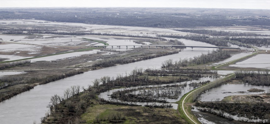 In this April 12, 2019 photo, the highway 34 bridge spans the Missouri River and it's flooded banks between La Platte, Nebraska and Glenwood, Iowa. 