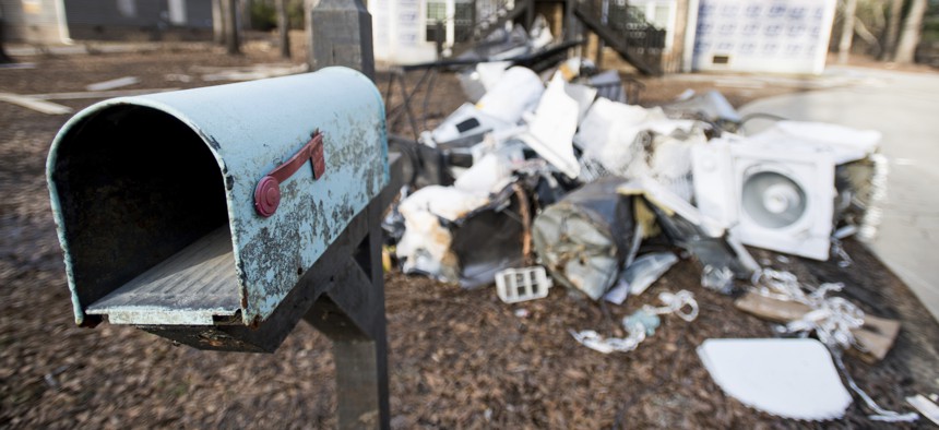 A mailbox stands in front of a a home damaged by flooding from Hurricane Florence near the Crabtree Swamp Friday, Feb. 1, 2019, in Conway, S.C. 