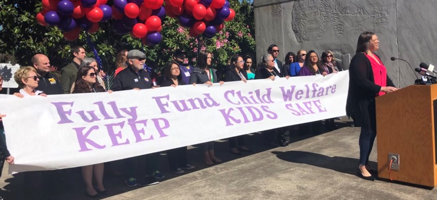 A rally for foster care caseworkers outside the Oregon state Capitol in April.