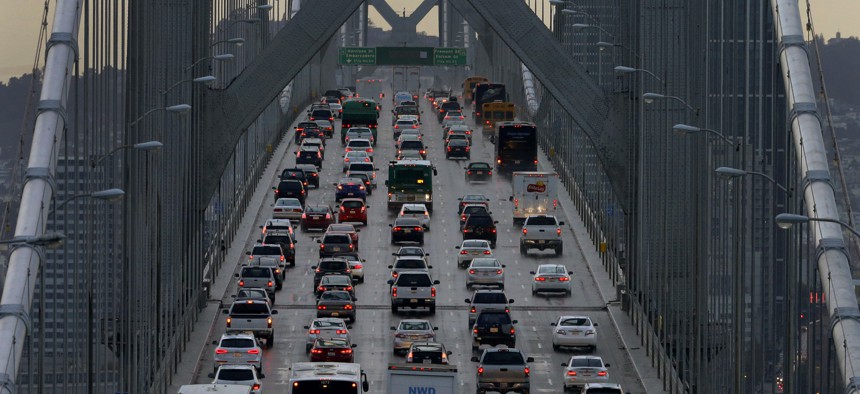 In this Dec. 10, 2015, file photo, vehicles make their way westbound on Interstate 80 across the San Francisco-Oakland Bay Bridge as seen from Treasure Island in San Francisco. 