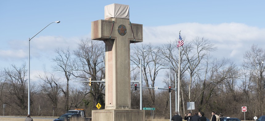 Visitors walk around the 40-foot Maryland Peace Cross dedicated to World War I soldiers on Wednesday, Feb. 13, 2019 in Bladensburg, Md. 