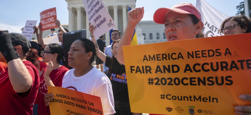 In this June 27, 2019, file photo, Demonstrators gather at the Supreme Court as the justices finish the term with a key decision in a case involving an attempt by the Trump administration to ask everyone about their citizenship status in the 2020 census.