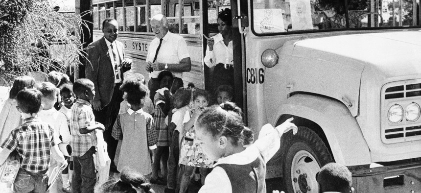 Young students head for a school bus in Berkeley, California on Feb. 24, 1970.