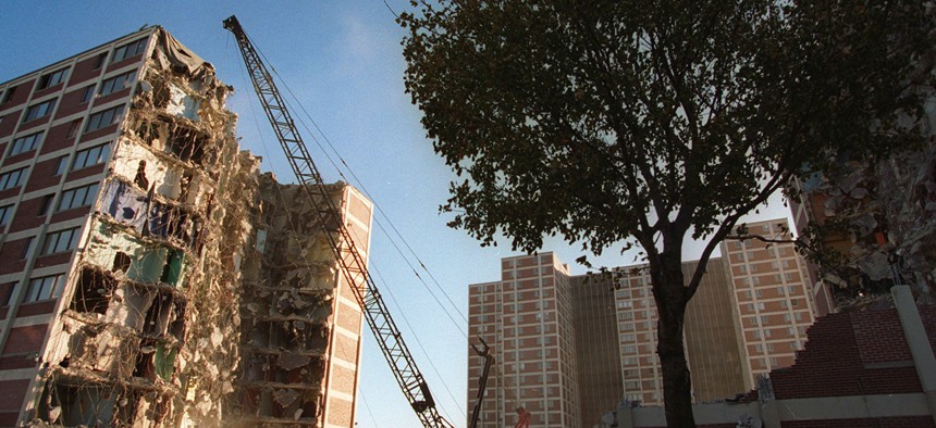 In this Wednesday, Nov. 8, 1995, file photo, a wrecking ball tears away at one of several Cabrini-Green public housing project buildings in Chicago. 