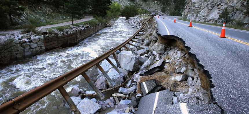 A road linking Boulder to a nearby mountain town was washed out by flooding. The county is seeking damages for the impacts of climate change.