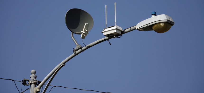 A transmitter with two antennas for wireless, high-speed Internet is seen strapped to a light pole on a residential street, Wednesday, May 16, 2007 in Lompoc, California. 