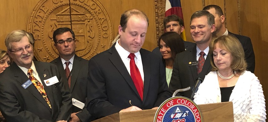 Colorado Gov. Jared Polis signs a bill that overhauls state oil and gas rules, shifting the focus away from encouraging production to make public safety and the environment their top priority. 