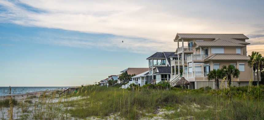 Houses sit on the Gulf Coast.