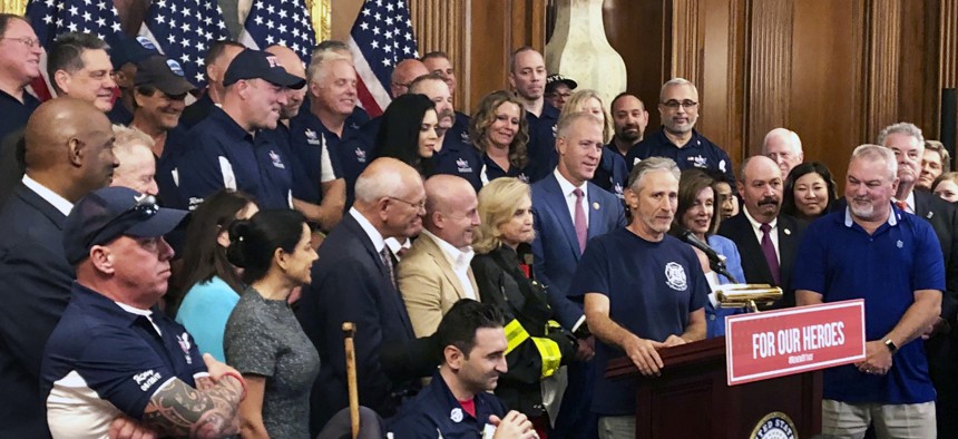 Entertainer and activist Jon Stewart, speaks at a news conference on behalf of 9/11 victims and families at the Capitol.