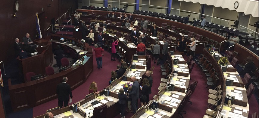 Assembly members gather before the Nevada State Assembly in Carson City, Nevada, in February 2019. 