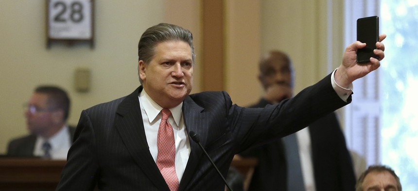 State Sen. Bob Hertzberg, D-Van Nuys, displays his smart phone as he urges lawmakers to approve a data privacy bill during the Senate floor session on June 28, 2018, in Sacramento, Calif.