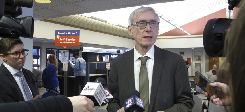 The lawsuit states that conservative writers were not extended invitations to certain press conferences with Gov. Tony Evers.