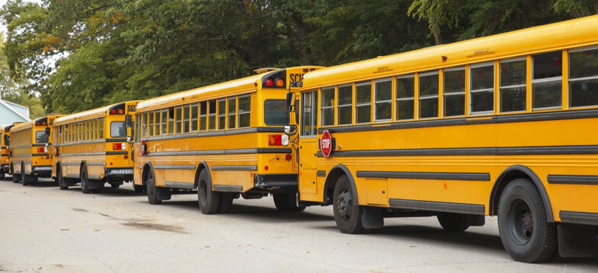 School buses line up in Boston, a city with one of the most challenging systems to route.