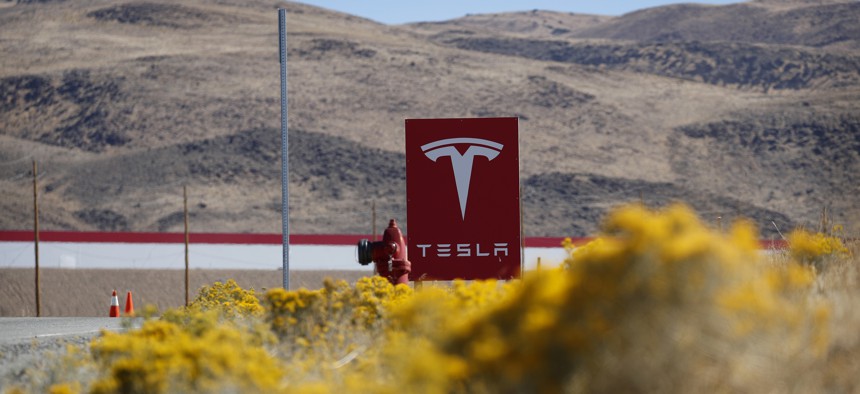 A sign marks the entrance to the Tesla Gigafactory in Sparks, Nev. A population inrush to Nevada has been driven by people seeking more affordable housing and a growing tech industry around Reno. 