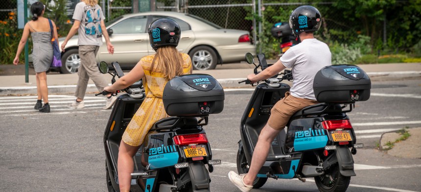Two riders in New York try out Revel mopeds.