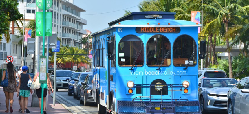 A blue trolley on the bus stop in Miami Beach. 