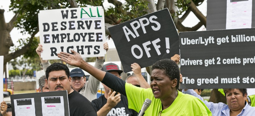 Uber and Lyft drivers protest their working conditions in Los Angeles in May 2019.