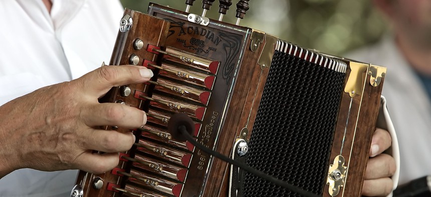 The experienced fingers of Marc Savoy, find their keys on the melodeon or cajun accordian at the at the Festivals Acadiens in Lafayette, La.