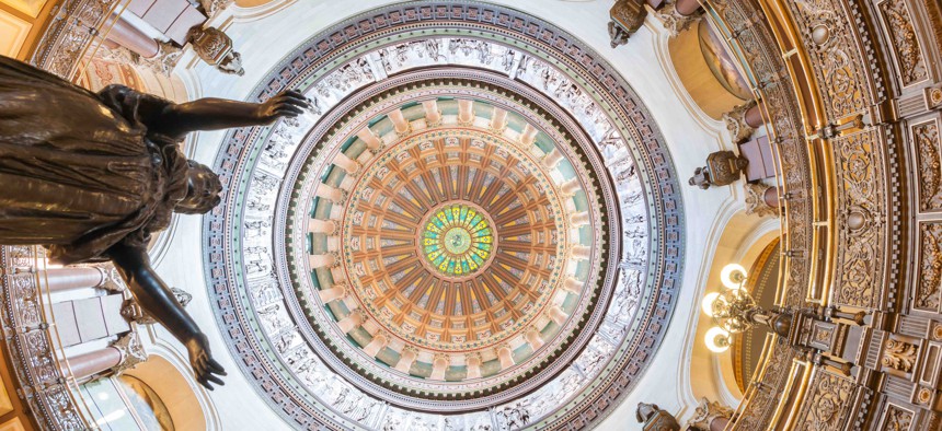 The dome inside the Illinois State Capitol. A proposed lawsuit over debt in the state came as lawmakers in the state continue to grapple with deficits and other budget issues.