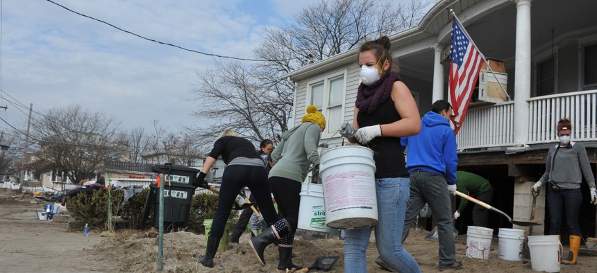 Neighbors help each other after Hurricane Sandy struck New York in 2012.