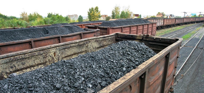 Coal sits in a train car. Wyoming’s coal industry is struggling to export its product.