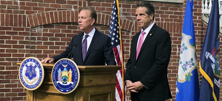 Connecticut Gov. Ned Lamont, left, speaks as New York Gov. Andrew Cuomo listens during a press conference, Wednesday, Sept. 25, 2019, in Hartford, Conn.