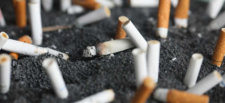 This March 28, 2019, photo shows cigarette butts in an ashtray in New York